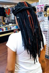 Box braids with accessories and red color