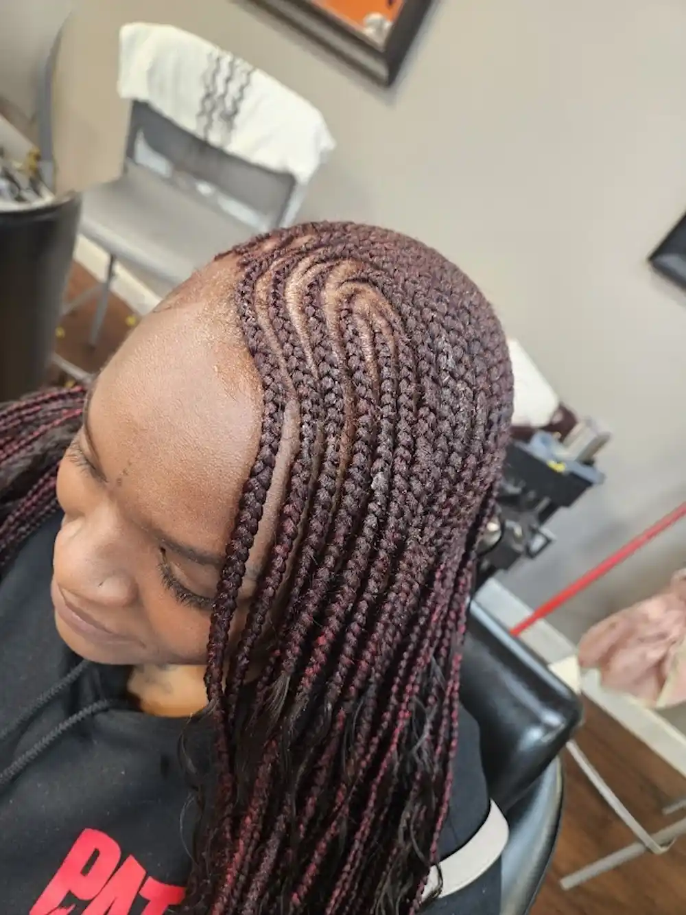 red side braids styled at Ramas Hair Braiding in Indianapolis